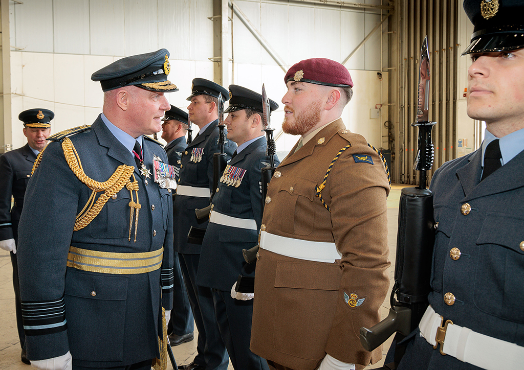 Chief of Air Staff, Air Chief Marshal Harv Smyth, talks with a 47 Air Despatch (AD) Squadron Royal Logistic Corps member, while reviewing the parade.